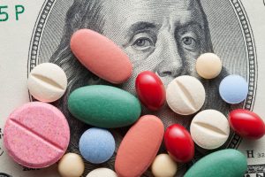 pills money medicine prescription drug prices cash money